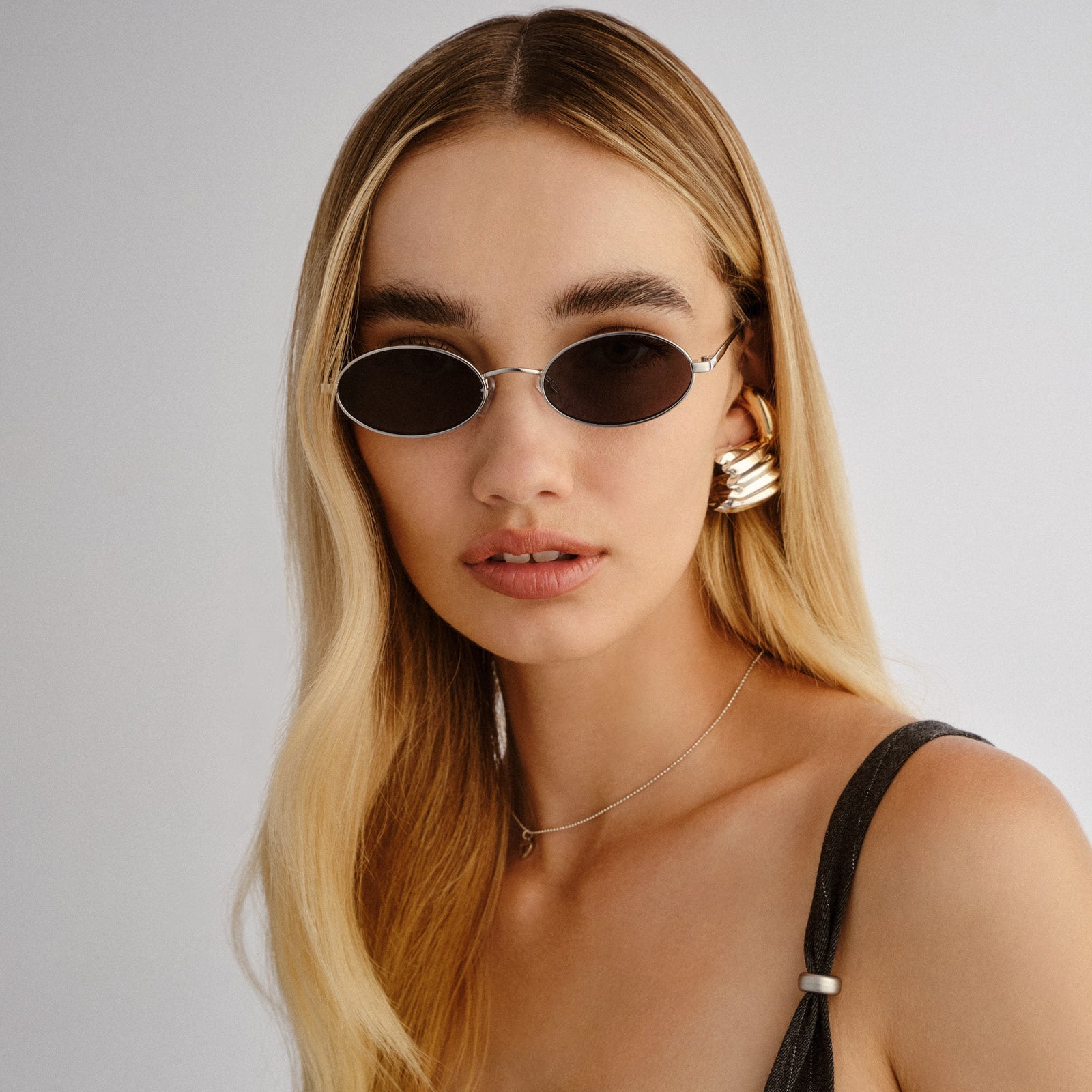 Love Train Silver Female Oval Sunglasses | Le Specs